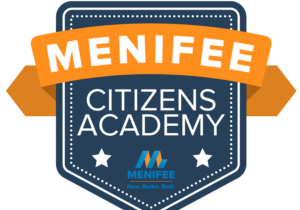 Menifee Citizens Academy Logo Blue Seal with White Font and Orange Ribbon